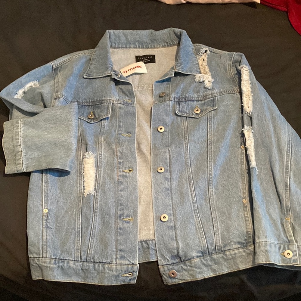 Light wash distressed denim jacket